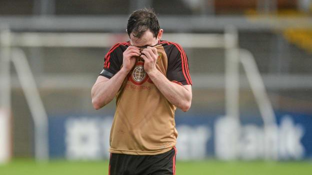 Conaill McGovern, Down, leaves the field after defeat to Cork