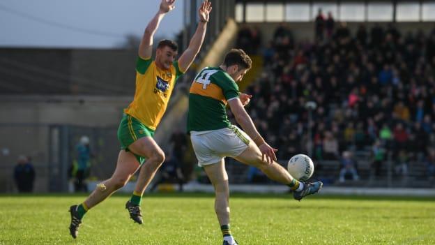 Leo McCloone, Donegal, attempts to block down an effort from Kerry full forward Paul Geaney.