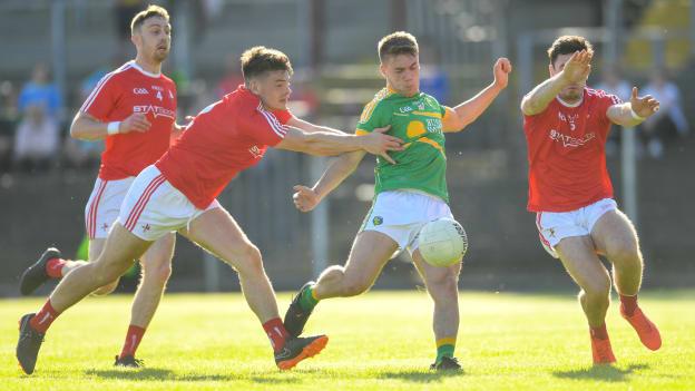 Louth's Darren Marks attempts to block down Leitrim's Darragh Rooney at Pairc Sean MacDiarmada.