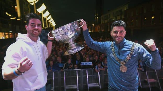 Michael Darragh Macauley, left, and Bernard Brogan with the Sam Maguire Cup during the Dublin All-Ireland Football Winning team homecoming at Smithfield in Dublin this year.
