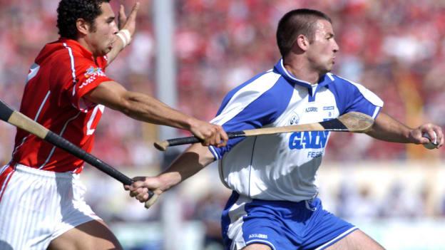 Waterford's Dan Shanahan in action against Cork's Seán Óg Ó hAilpín in the 2004 Munster SHC Final. 