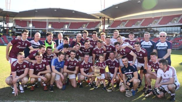 Galway players and officials celebrate after defeating Kilkenny to win the inaugural Wild Geese Trophy. 