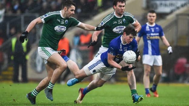 Darren Hughes, Scotstown, challenged by Gaoth Dobhair's Michael Carroll and Eamonn McGee at Healy Park.