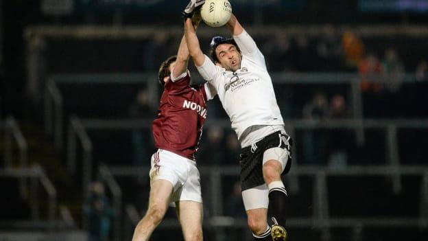 Joe McMahon catches the ball in the 2014 Ulster final loss to Slaughtneil