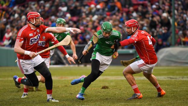 Barry Murphy of Limerick in action against Damien Cahalane, left, and Colm Spillane of Cork during the Fenway Hurling Classic 2018 Final match between Cork and Limerick at Fenway Park in Boston.