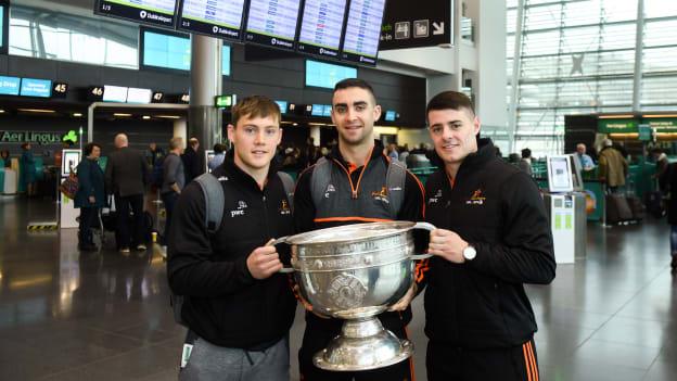 Dublin players, from left, Con O'Callaghan, James McCarthy and Brian Howard with the Sam Maguire Cup at Dublin Airport prior to their departure to the GAA GPA PwC All Stars tour in Philadelphia, USA. 