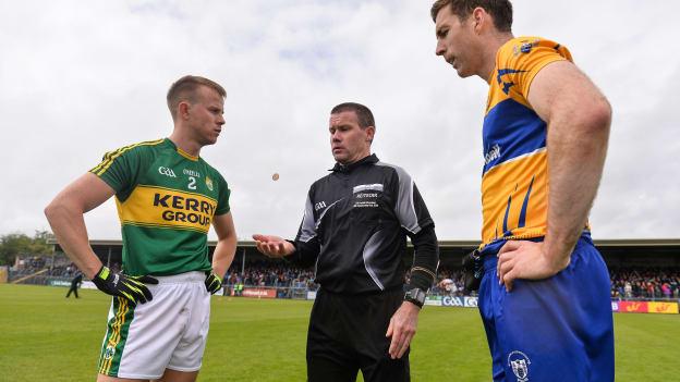 Fionn Fitzgerald, Kerry, and Gary Brennan, Clare, pictured with referee Padraig Hughes in Cusack Park in 2017.