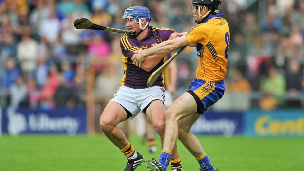 Ian Byrne and Patrick Donnellan collide during the 2014 All Ireland SHC Round 1 replay at Wexford Park.