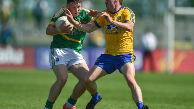 Conor Devaney, who scored two goals for Roscommon and James Rooney, Leitrim, collide at Dr Hyde Park.