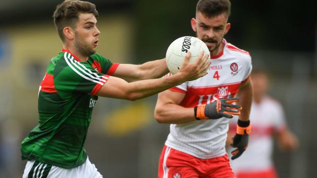 Oisin McLaughlin, Mayo, and Eoghan Concannon, Derry, in action at Pairc Sean MacDiarmada.