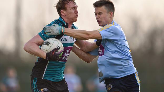 Paul Cribbin, NUI Maynooth, and Eoin Murchan, UCD, in Electric Ireland Sigerson Cup action.