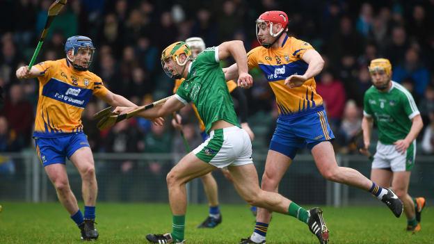 Dan Morrissey, Limerick, and Podge Collins and Niall Deasy, Clare, in action during the Munster Hurling League Final at the Gaelic Grounds.