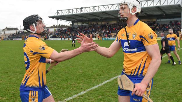 Ian Galvin (left) and Conor Cleary (right) celebrate Clare's Allianz Hurling League Division 1A win over Kilkenny in Nowlan Park