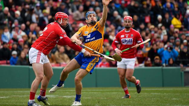 Shane O'Donnell of Clare in action against Seán O'Donoghue, left, and Colm Spillane of Cork during the Aer Lingus Fenway Hurling Classic 2018 semi-final.