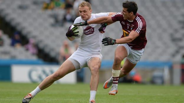 Tommy Moolick and Denis Corroon in action at Croke Park.