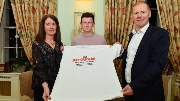 Sean Cox’s wife, Martina, son Jack, and St Peter's, Dunboyne GAA Chairman Fergus McNulty pictured at the launch of Sunday's fundraiser game between Meath and Dublin at Pairc Tailteann.