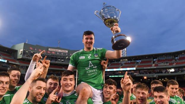 Limerick captain Declan Hannon is held aloft by his team mates as they celebrate with the Players Champions Cup after winning the Aer Lingus Fenway Hurling Classic 2018 Final match between Cork and Limerick at Fenway Park in Boston.