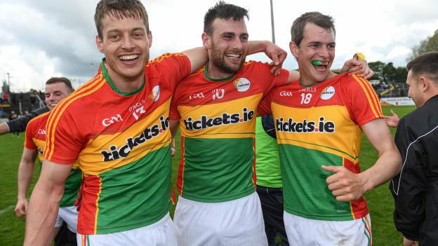 Carlow footballers Paul Broderick, Eoghan Ruth, and Sean Gannon celebrate following a dramatic win at Netwatch Cullen Park.