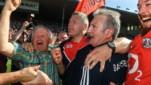Cork supporters celebrate with manager Kieran Kingston and selector Diarmuid O Sullivan at Semple Stadium.