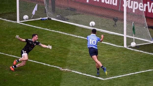 Niall Scully fists Dublin's second goal of the match past Niall Morgan to the Tyrone net. 
