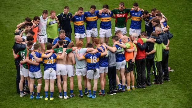Tipperary manager Liam Kearns speaks to his players following the game.