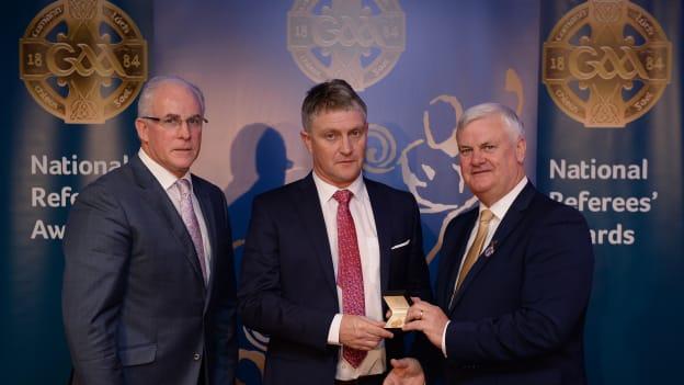 Barry Kelly is presented with his All-Ireland Medal by Uachtarán Chumann Lúthchleas Aogán Ó Fearghail and Seán Walsh, Chairman of National Referee Development Committee, at the GAA National Referees Awards Banquet.