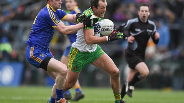 Michael Murphy, Donegal, and Kevin Higgins, Roscommon, collide at Dr Hyde Park.