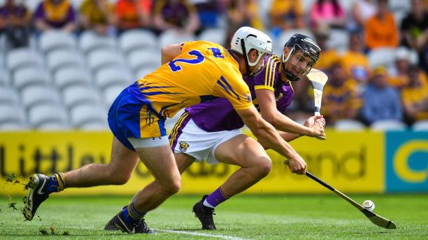Patrick O'Connor, Clare, and Jack O'Connor, Wexford, collide during the All Ireland SHC Quarter-Final at Pairc Ui Chaoimh.
