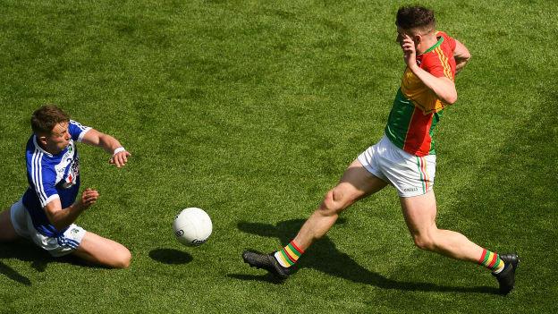 Stephen Attride of Laois dives in bravely to tackle Ciarán Moran of Carlow in last year's Leinster SFC semi-final, moments before an accidental collision left him with a fractured skull. 