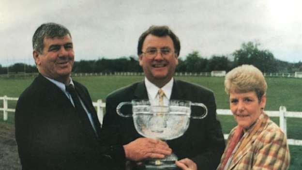 Former GAA President, Joe McDonagh, centre, pictured holding the Derek Brady Cup with Derek's parents Liam and Marie. 