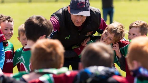 Mentor Alan O'Donnell, a former St James' player, talks to Academy players before a recent blitz.