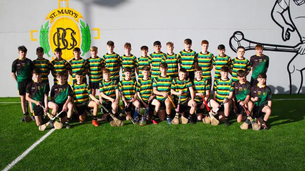 The St. Mary's CBGS Leonard Cup winning team pose for a photo in front of the school's new ball wall. 