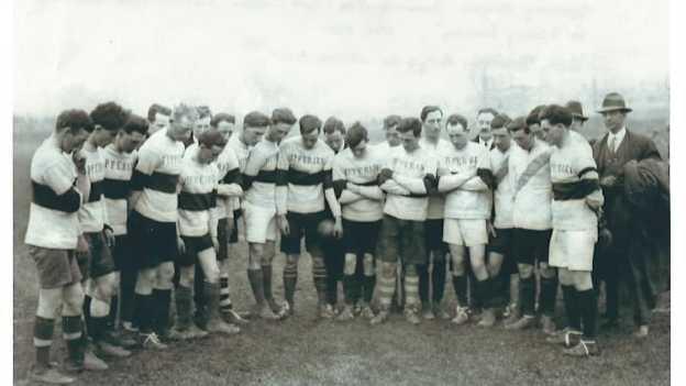 The Tipperary football team look at the spot in Croke Park where Michael Hogan died on Bloody Sunday. 