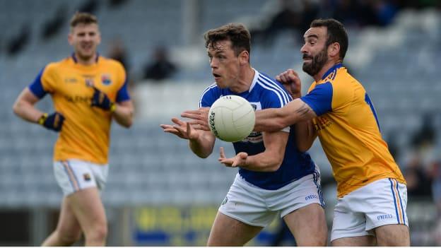 John O'Loughlin, Laois, and Diarmuid Masterson, Longford, collide during the 2017 Leinster Senior Football Championship.