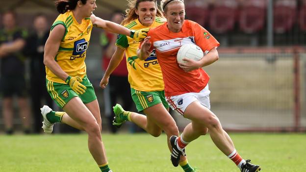 Marian McGuinness of Armagh in action against Aoife McDonald and Niamh Hegarty of Donegal during the 2018 TG4 All-Ireland Ladies Football Senior Championship quarter-final match between Armagh and Donegal at Healy Park in Omagh, Tyrone.