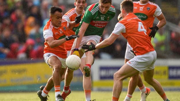 Fionn McDonagh of Mayo in action against Jemar Hall, left, and Paul Hughes, 4, of Armagh during the GAA Football All-Ireland Senior Championship Round 3 match between Mayo and Armagh at Elverys MacHale Park in Castlebar, Mayo. 