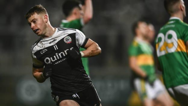 Jerome Johnston celebrates after scoring a decisive goal for Kilcoo during the AIB Ulster GAA Football Club Senior Championship Semi-Final against Derry champions Glen at the Athletic Grounds in Armagh. 
