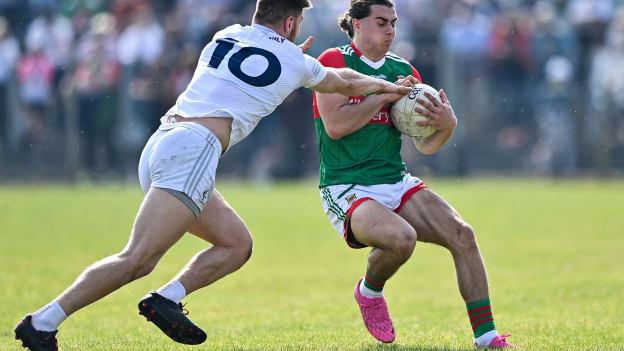 Oisín Mullin, Mayo, and Kevin O'Callaghan, Kildare, in Allianz Football League action.