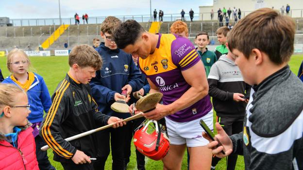 Wexford's Lee Chin signs autographs for supporters after the game at Austin Stack Park.