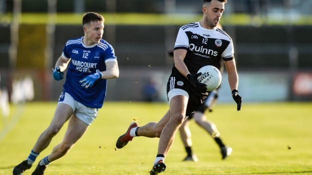 Ryan Johnston of Kilcoo in action against Eunan Doherty of Naomh Conaill during the AIB Ulster GAA Football Senior Club Championship Final.