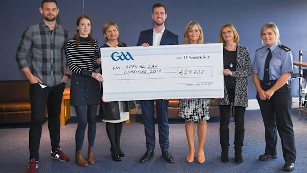 GAA representative Kevin Sexton, left, and member of An Garda Síochána Jen Keegan, right, present a cheque to, from left, Deidre Walsh of Western Alzheimers, Liz Yates of the Marie Keating Foundation, Donal Kitt of Enable Ireland and Ciara Carty and Elaine Fleming of Focus Ireland during the GAA Charities Cheque Handover at Canal Café in Croke Park.