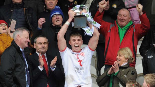 Tyrone captain Antoin Fox raises the Danny Murphy Cup.