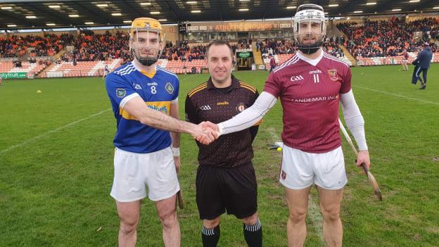 Matthew Conlan, Portaferry, and Neil McManus, Cushendall, pictured with referee Tarlach Conway. Photo by Ulster GAA