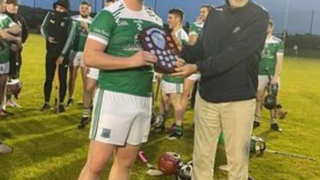 Lisbellaw captain Eoin Cleary pictured with GAA President Larry McCarthy. 