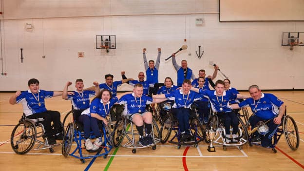Munster players and staff celebrate with the cup after the 2023 Wheelchair Hurling / Camogie All Ireland Final match between Ulster and Munster at SETU Carlow Sports Hall in Carlow. Photo by Ben McShane/Sportsfile.