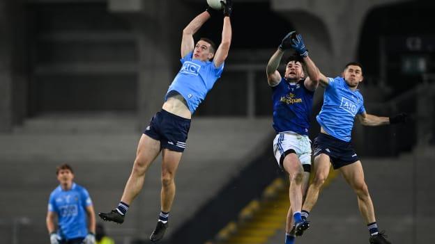 Brian Fenton of Dublin gathers possession ahead of team-mate David Byrne and Thomas Galligan of Cavan during the GAA Football All-Ireland Senior Championship Semi-Final match between Cavan and Dublin at Croke Park in Dublin. 