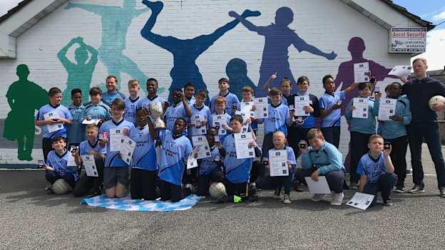 Pupils of St Michael's Boys National School in Longford celebrate with their recently won Cumann na mBunscol medals. 