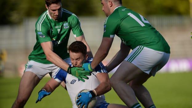Fintan Kelly, Monaghan surrounded by Eoin Donnelly and Sean Quigley, Fermanagh, in Clones.