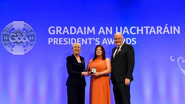 Maggie Skelton of Achadh Uí Arain, Tír Eoghain, is presented with the Ladies Football Award by Maolmhuire Tynan, Head of Public Affairs AIB, and Uachtarán Chumann Lúthchleas Gael John Horan during the GAA President’s Awards at Croke Park in Dublin. 