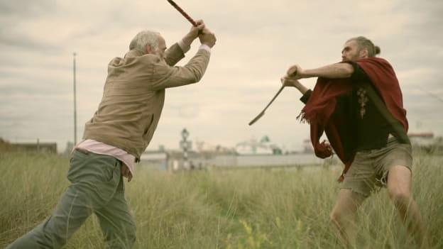 Kila lead singer, Rónán Ó Snodaigh, and former Wexford hurler, Diarmuid Lyng, pictured shooting the video for the song, 'Calling All Angels', on Dublin's Shelley Bank Beach. Photograph by Myles O'Reilly. 